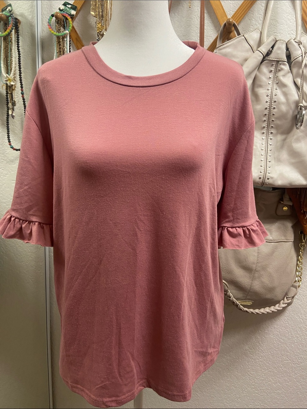 Women's Pink Ruffle Short Sleeve Tee.